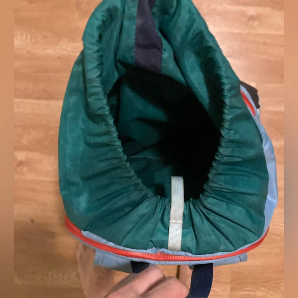 cotopaxi navy blue light blue green striped backpack